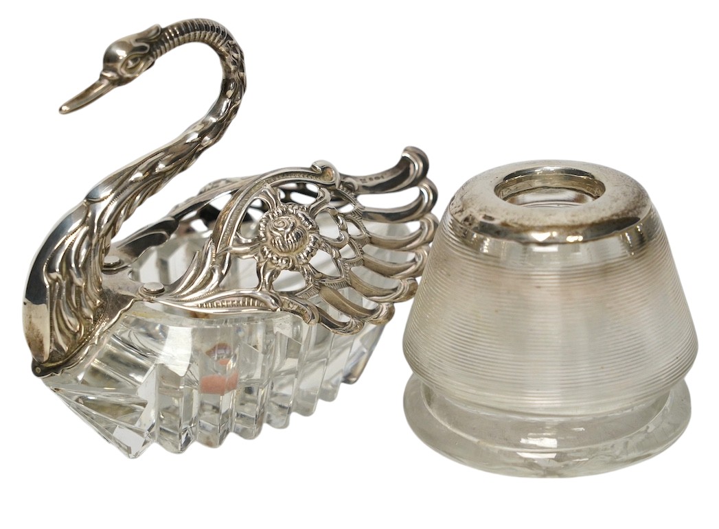 A white metal mounted glass match strike and a silver mounted swan bon bon dish, 10cm. Condition - poor to fair